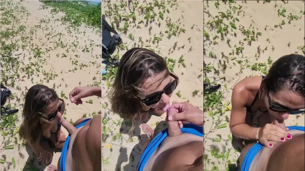 Nino e Aline se divertindo com um sexo oral na praia, com aquele momento de prazer na boca